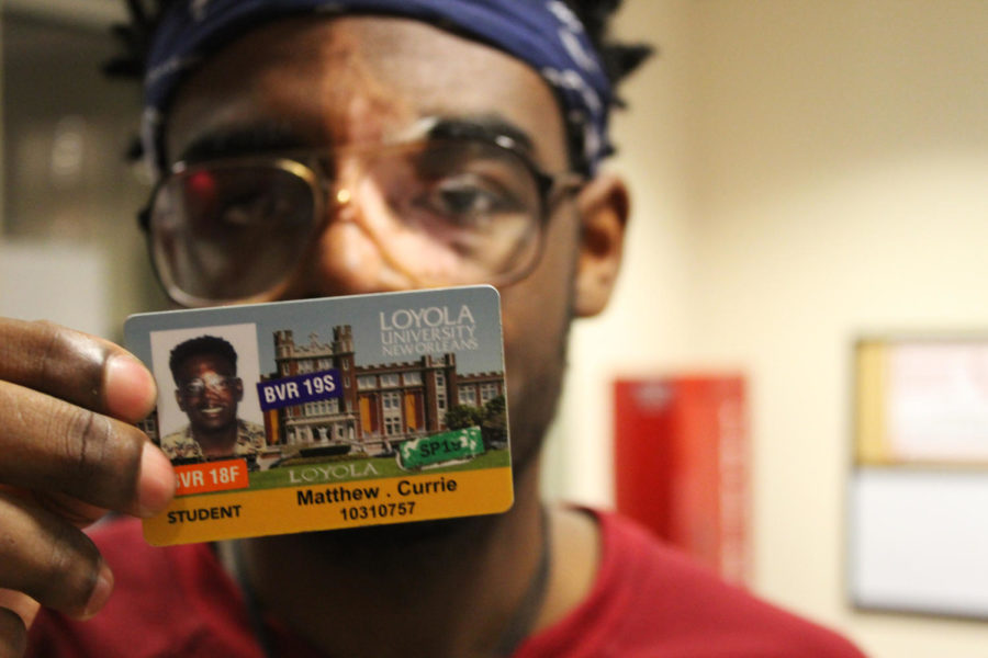 Matthew Currie, music industry freshman, shows his Loyola student ID upon entering Biever Hall on March 5, 2019. Last month, the university implemented a policy that requires students to show their IDs upon entering a residence hall or face a fine. Photo credit: Jawdat Tinawi