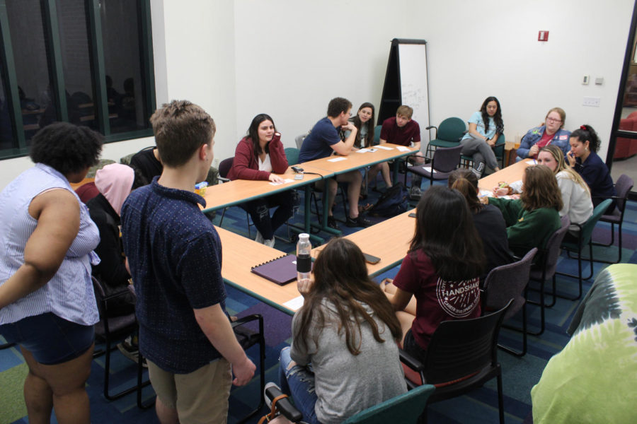 Chandler Boudreaux, finance freshman, and Shamaria Bell, general studies freshman, lead the first meeting of the Photography Organization for Wolves on March 13, 2019. Photo credit: Cristian Orellana