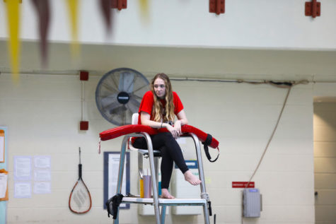 Business senior Robyn Caire watches over the pool from her lifeguard chair in the University Sports Complex.