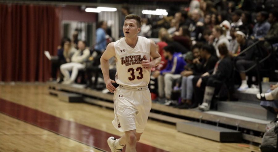 Finance senior Ethan Turner (33) jogs in transition at a Loyola home game in The Den. Turner won three scholar awards this season. Photo credit: Andres Fuentes