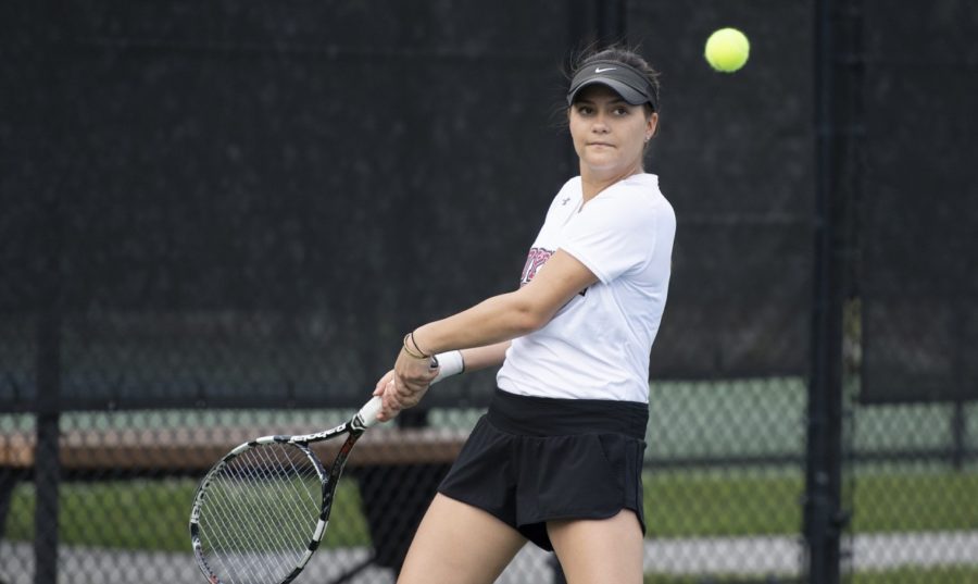 International business sophomore Manuela Alban would continue the Wolf Packs success in singles play. Alban won her with a perfect 6-0, 6-0 in court two, but the Crusaders would win out the remaining for matches, leaving them as the victors. Photo credit: Kyle Encar