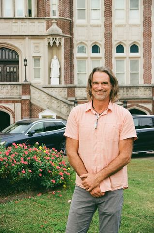 Nathan C. Henne, Latin American Studies and Spanish professor, poses in the Loyola University horseshoe. HOLoyno is a project by Sofia Santoro, psychology sophomore that highlights the creativity and diversity across Loyola's campus.