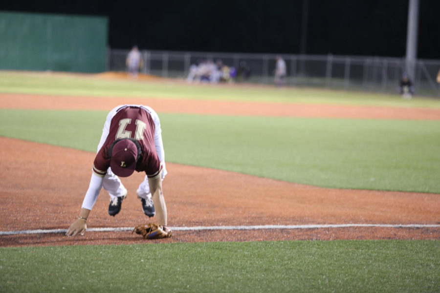 Business analytics freshman Patrick Chen See (17) falls after missing a foul ball. Loyola's baseball team sits in the bottom of the conference standings without a win against Southern States Athletic Conference team. Photo credit: Andres Fuentes