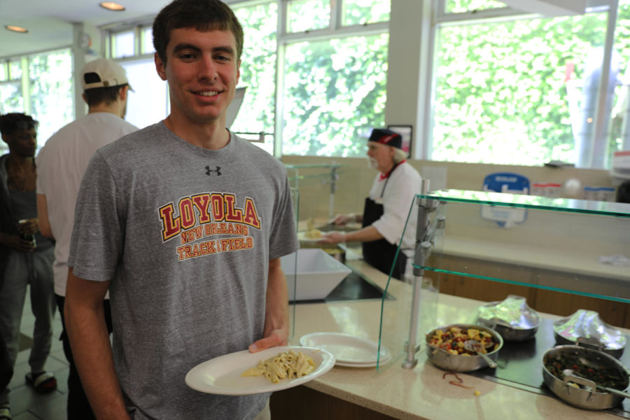 Environmental studies sophomore Liam Donovan picks up a plate of pasta in the Orleans Room. Wolf Pack athletes try their best to maintain a healthy diet.