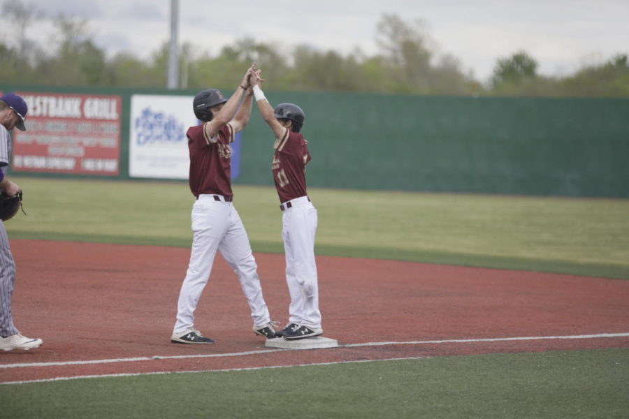 Two Loyola baseball players celebrate an offensive play at Segnette Field. The baseball team earned 12 conference awards. Photo credit: Andres Fuentes