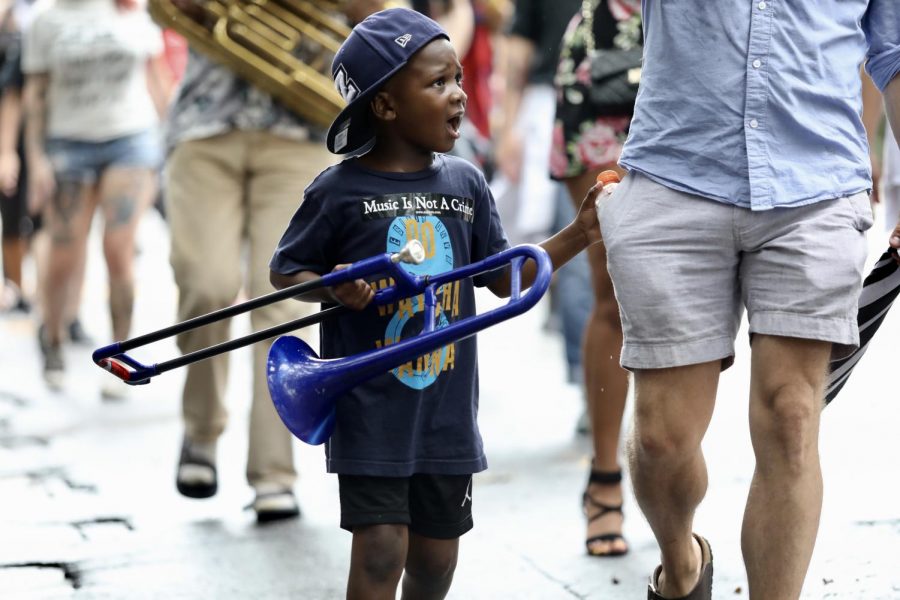 A child brought his trombone to perform in the second line for Eugene Grant on July 21, 2019.