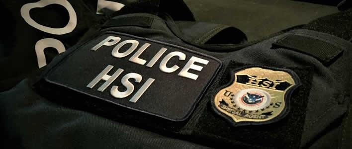 An armored vest displays a Homeland Security Investigations badge. HSI participated in the Aug. 14 raid.