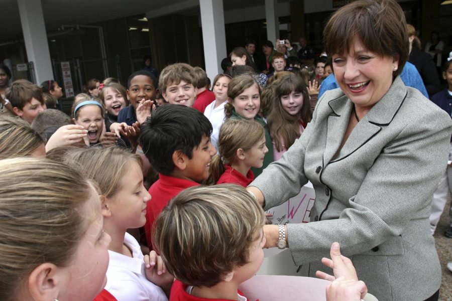 FILE- In this Nov. 6, 2007 file photo, Gov. Kathleen Babineaux Blanco is greeted by students of Maplewood Middle School in Sulphur, La.  Blanco, who became Louisianas first female elected governor only to see her political career derailed by the devastation of Hurricane Katrina, died Sunday, Aug. 18, 2019. She was 76.  (Brad Puckett/American Press via AP, File)