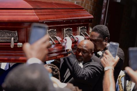 Family members carry Dave Bartholomew's casket out of St. Gabriel the Archangel Roman Catholic Church on July 8, 2019. A stationary second line took place afterward with the Treme Brass Band. Photo credit: Andres Fuentes