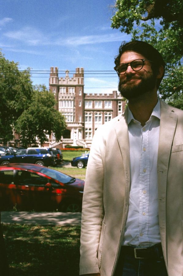 Philosophy professor Everett Fulmer poses for a photo in front of Loyola University. Photo credit: Sofia Santoro
