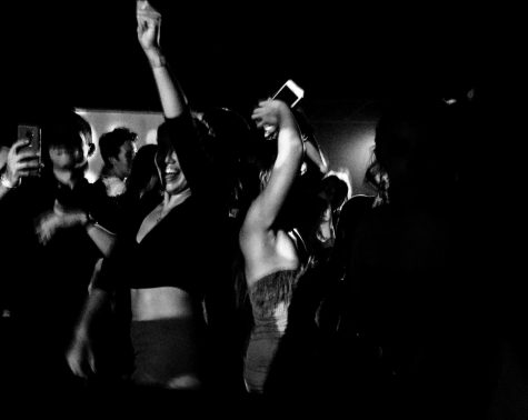 Girls dance at an Uptown bar on Sept. 6. An arrest was made in the most recent case of sexual assault.