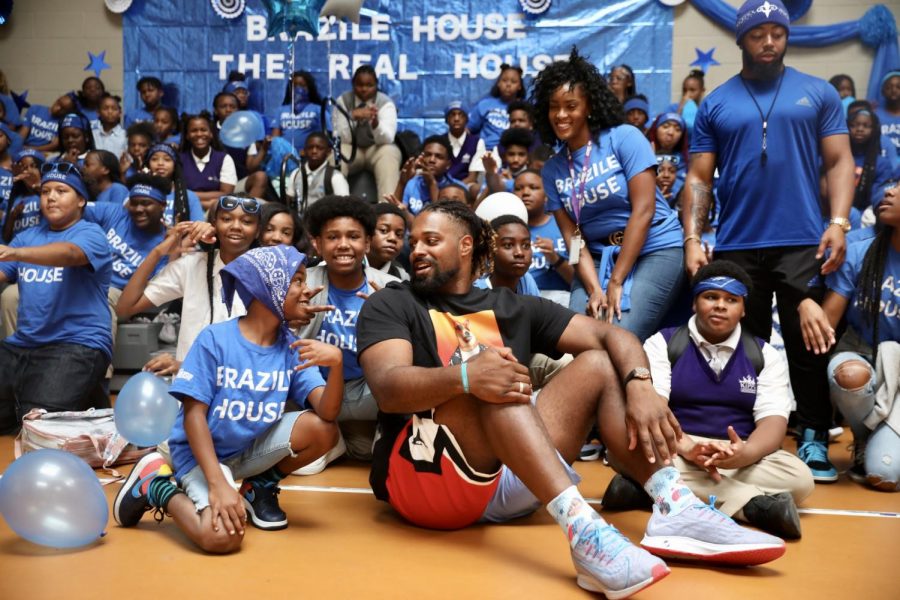 New Orleans Saints defensive end Cam Jordan takes his day off to visit students at KIPP Leadership Academy on September 3, 2019. Jordan and other organizations gave the school 400 backpacks and $10,000 to help with school activities. Photo credit: Andres Fuentes