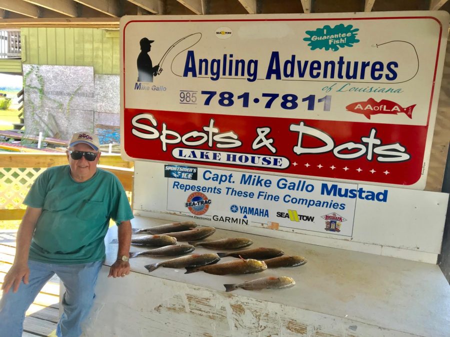 One of Mike Gallo's clients poses with their catches after a fishing trip in mid-September. 