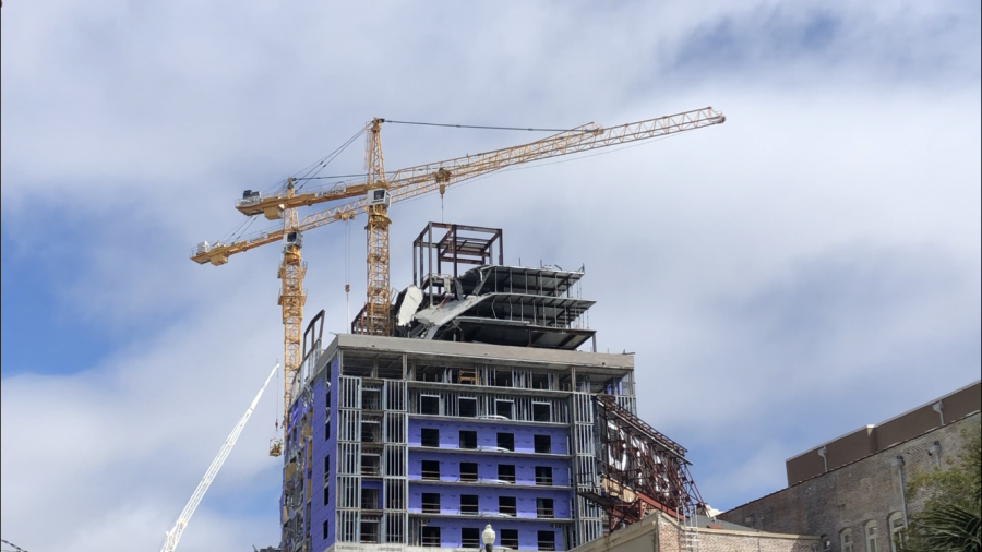 Two cranes secure the Hard Rock Hotel after it collapsed last weekend. The planned demolition of the two cranes has been rescheduled for a second time. Photo credit: Erin Snodgrass