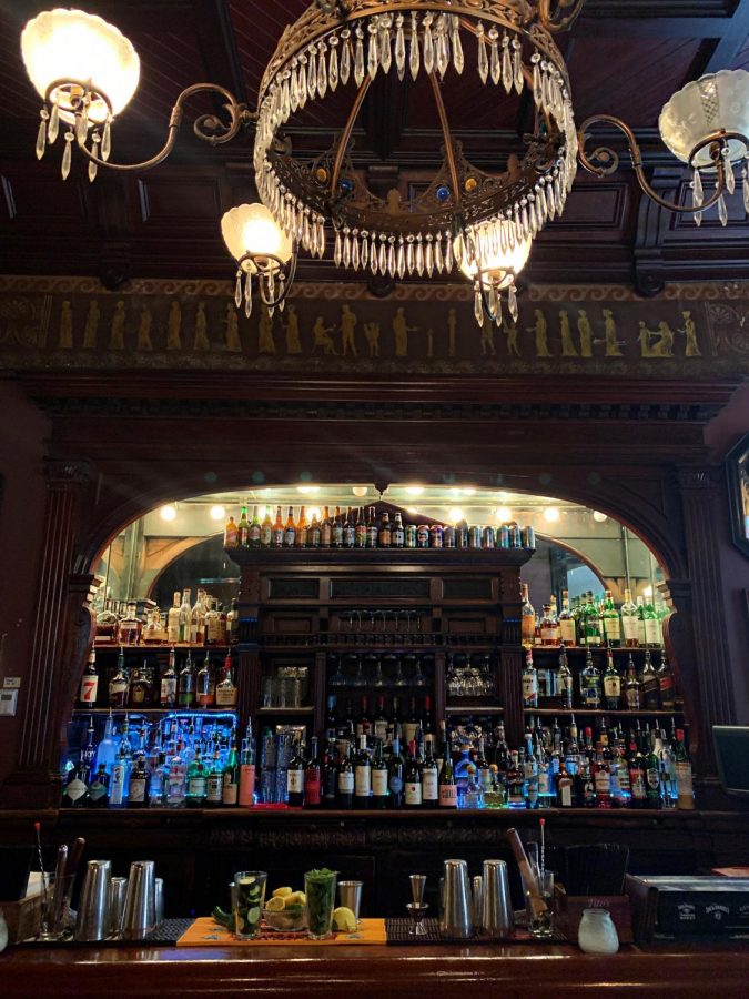 The Columns bar sits inside the St. Charles Hotel on a slow afternoon. Makayla Wynia serves drinks here while also working on her homework. Photo credit: Lucy Foreman