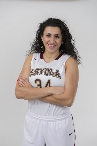 Loyola alumna dribbles from the court to the football field