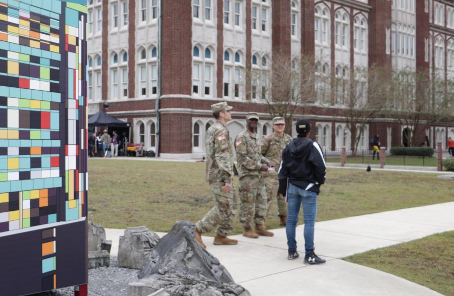 A commercial production filming on campus redesigns a Loyola sign for their set on Nov. 8 2019. The production sparked controversy when students and faculty reported hearing simulated gunshots. Photo credit: Hannah Renton