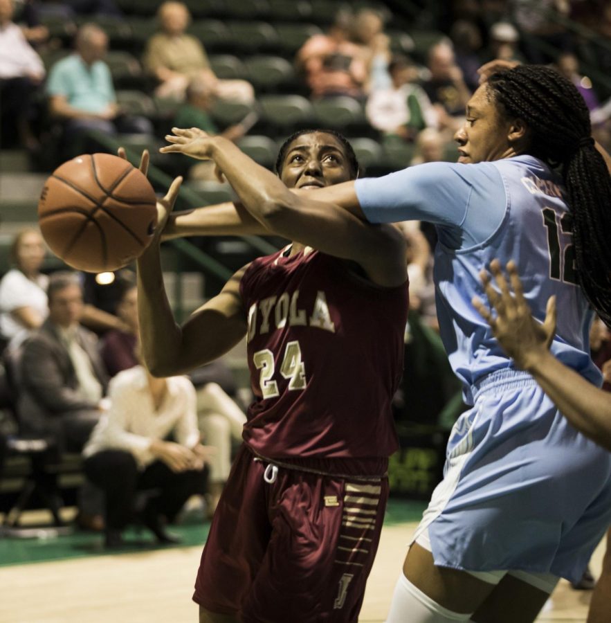 Breyah Richardson goes up for a contested layup in the first game of the year against Tulane University Green Wave on Oct. 30, 2019.  Tulane took the match, winning 61-38. Photo credit: Michael Bauer