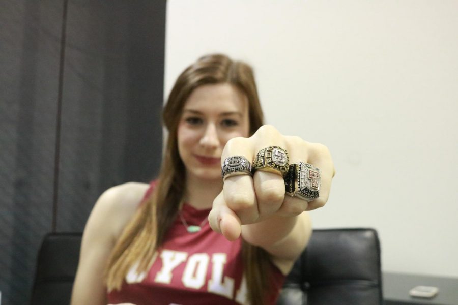 Accounting senior Paige Franckiewicz flashes her three Loyola University New Orleans championship rings. Franckiewicz earned one ring her freshmen year after the womens basketball team won the regular season title, and two rings the next two years for being on conference title-winning teams.