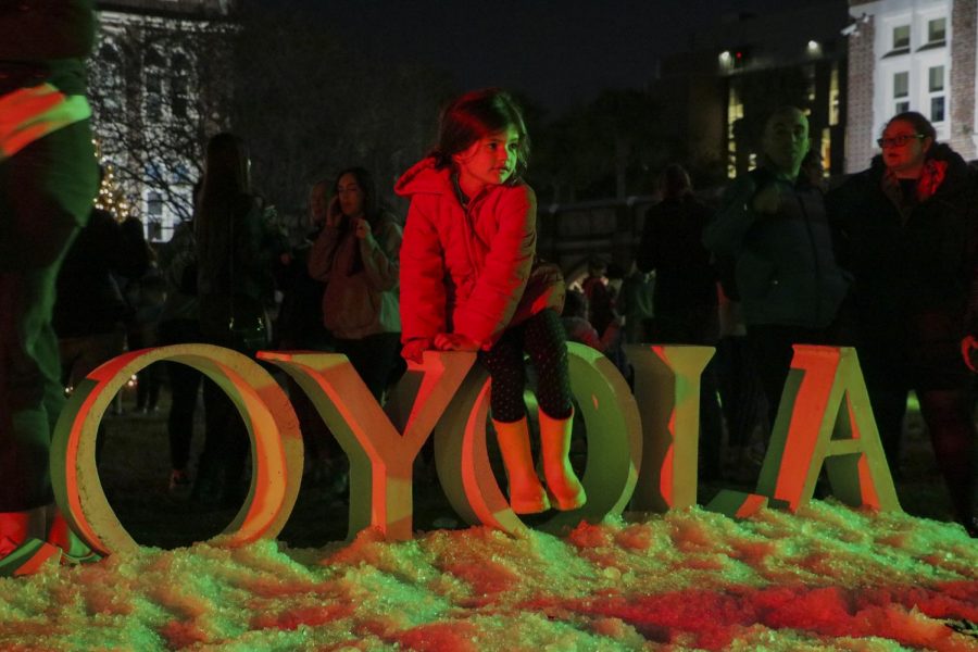 The+Loyola+sign+on+the+universitys+front+lawn+is+lit+up+by+Christmas+lights+for+Sneaux.+Sneaux+took+place+on+the+campus+front+lawn%2C+or+the+horseshoe%2C+on+Tuesday+Dec.+3rd%2C+2019.+