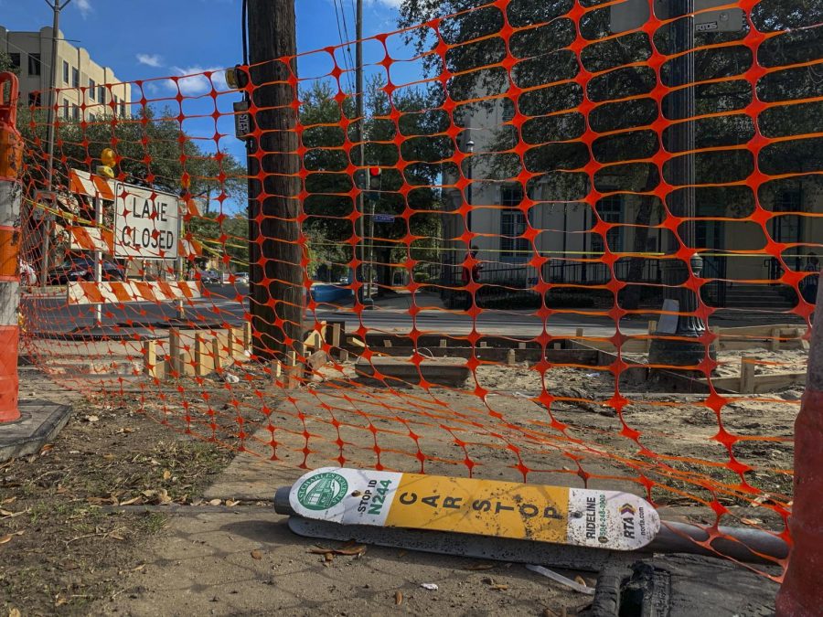 A streetcar sign lies on the corner of Jackson and St. Charles. A 2016 lawsuit is responsible for construction making 6 streetcar stops accessible. Photo credit: Alexandria Whitten