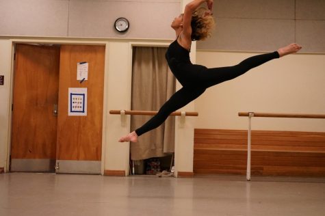 Andi Robinson pictured jumping while dancing.