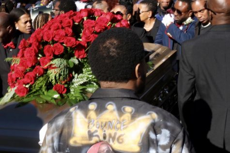 Mourners carry 5th Ward Weebie's casket.