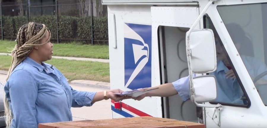 Tomeka Burton personally receives her package from United States Postal Service
