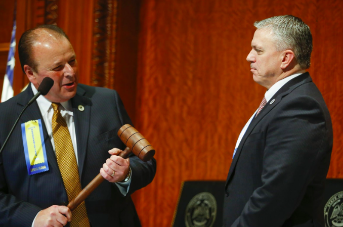 Exiting House Speaker Taylor Barras, R-New Iberia, left, prepares to pass the gavel to newly elected House Speaker Clay Schexnayder, R-Gonzales, at the state Capitol in Baton Rouge, La., Monday, Jan. 13, 2020.