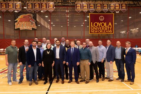 2020 inductees to the Wolf Pack Athletic Hall of Fame gather during halftime at a basketball hall of fame game . Those pictured were inducted officially at the ceremony Jan. 18, 2020. Courtesy of Kyle Encar