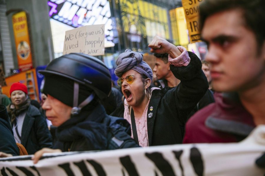 Activists march in Times Square to protest recent U.S. military actions in Iraq on Saturday, Jan. 4, 2020, in New York.  A top Iranian general and Iraqi militiamen were killed in a U.S. airstrike  that sharply escalated tensions across the region. Photo courtesy of Associated Press.