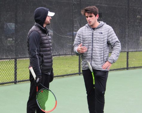 Coach Matthew Llewelyn speaks to player Emilio Saenz at team practice. Wolf Pack athletics hired Llewelyn last November.