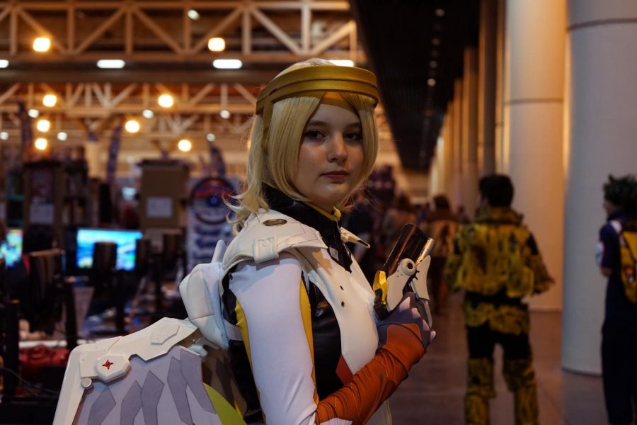Kayoki cosplays as Mercy from Overwatch, holding her pistol on Jan. 4, 2020. Plenty of cosplayers flooded Wizard World Comic Con.