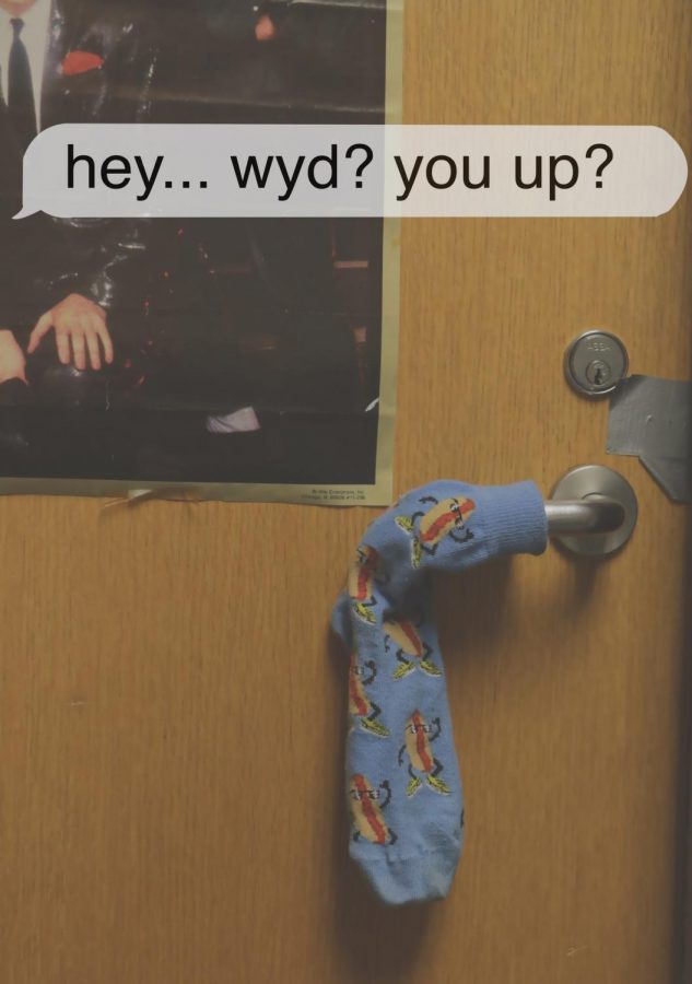 A sock on a door handle with a text tag on the top rading "hey... wyd? you up?