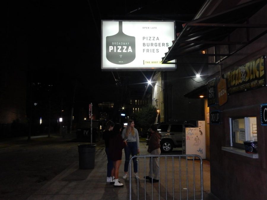 people under broadway pizza sign.JPG
