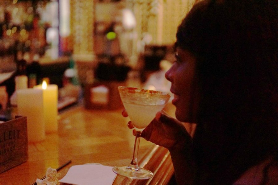 A Delgado Community College Nursing student sips a drink at Chais Delachaise. The restaurant has two locations Uptown. Photo credit: Peter Buffo