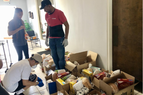 Celebration church volunteers pack 22 care packages for those in the community in need for supplies.