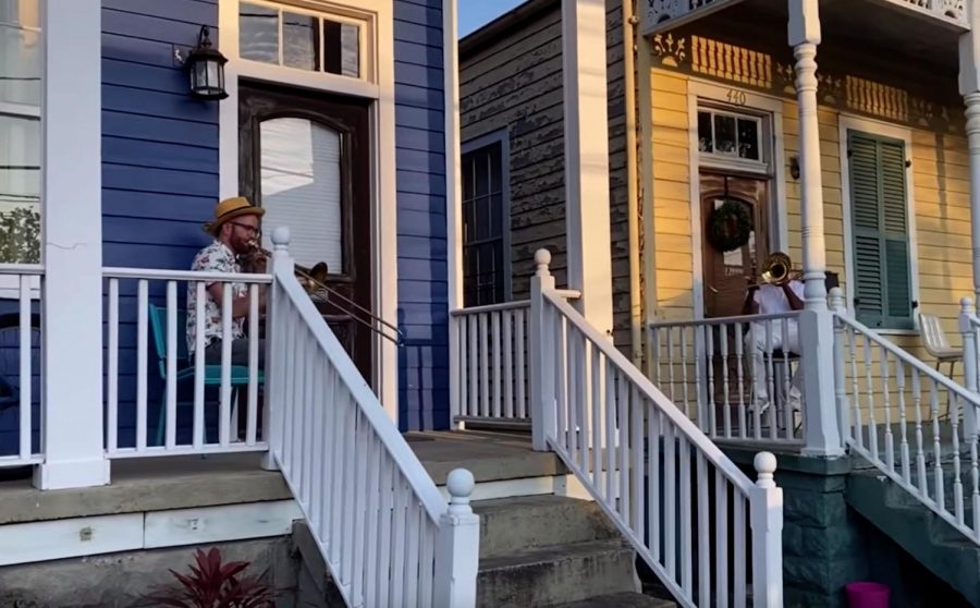 Musicians, Charlie Halloran, and Richard "Kinfolk" Anderson practicing social distancing while playing their trombones together in Algiers on April 3, 2020.