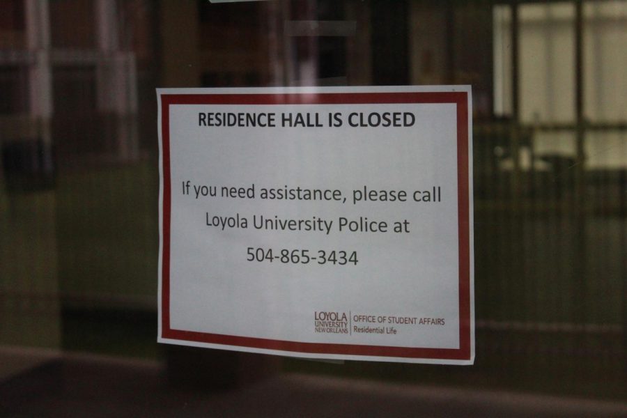 A sign that residence halls are closed due to COVID-19 is posted on the door to Carrollton Hall on May 17, 2020. Upperclassmen were notified in a May 21 email that they would no longer be provided on-campus housing for the fall 2020 semester in order to decrease the density of students on campus due to COVID-19 safety concerns.