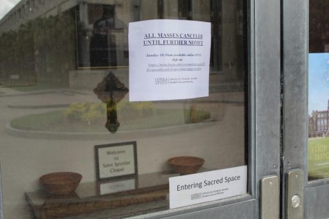 A sign on the door to Ignatius Chapel on Loyolas campus on May 17, 2020 references the closure of in-person worship services. The chapel re-opened on May 17 for in-person Sunday mass for the first time since the universitys closure back in March. Photo credit: Alexandria Whitten