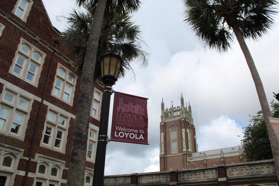 A 'Welcome to Loyola' sign waves outside Thomas Hall on May 17, 2020. The university posted a fall 2020 schedule to its website on May 19 that says the university will resume on-campus classes Aug. 24 with online classes and finals between Thanksgiving and the spring semester. Photo credit: Alexandria Whitten