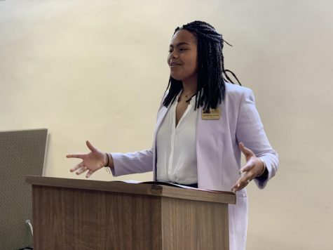 Jessamyn Reichmann, SGA President, addresses the student body on Wednesday, March 11. Photo credit: Cristian Orellana