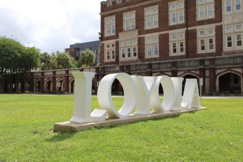 White cement letters spell out Loyola