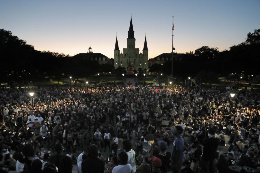 People attend a rally outside Jackson Square in New Orleans, Friday, June 5, 2020, protesting the death of George Floyd who died after being restrained by Minneapolis police officers on May 25. (AP Photo/Gerald Herbert)