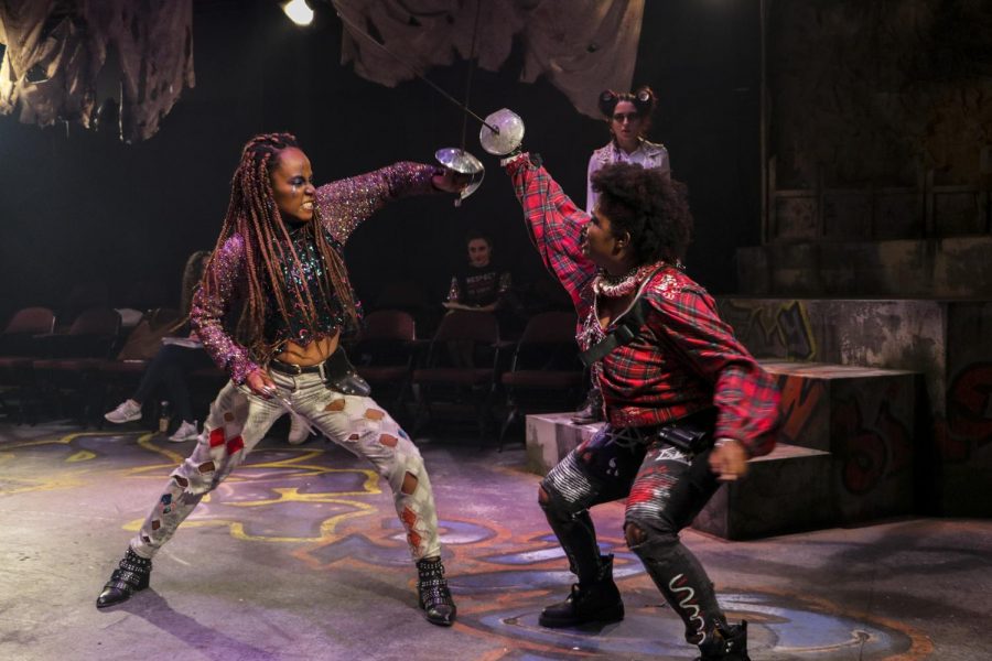 Talia Moore (right), A20, performs a fight scene as Mercutio in Romeo & Juliet in 2019. Moore was one of several theater students of color who said they felt typecast in the departments productions, but her role as Mercutio in Romeo and Juliet was one of the first opportunities she was able to play a non-traditional Black role.