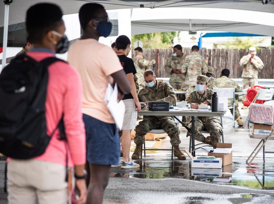 Members+of+the+Louisiana+National+Guard+sign+students+in+for+free+on-campus+testing+in+the+parking+lot+of+Mercy+Hall+Aug.+31.+Photo+credit%3A+Michael+Bauer