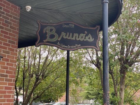 A sign hangs outside of Bruno's Tavern on Aug. 22. Bruno's is one of many bars in New Orleans that is struggling with new restrictions due to COVID-19. Photo credit: Shadera Moore