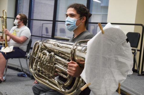 Senior music major Albert Bustillo sits with his tuba during a brass quintet rehearsal. Small ensembles, like his brass quintet, have replaced the orchestras and bands this semester as a result of COVID-19 related restrictions.