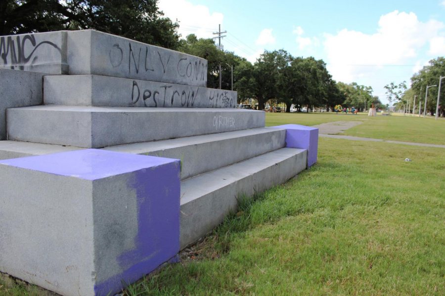 Graffiti covers the foundation that formerly held the Jefferson Davis Monument on Jeff Davis Parkway in New Orleans. The monument was removed in 2017 following protests. Photo credit: Alexandria Whitten
