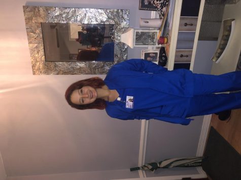 Makala Ougel, poses for a photo in her healthcare uniform.